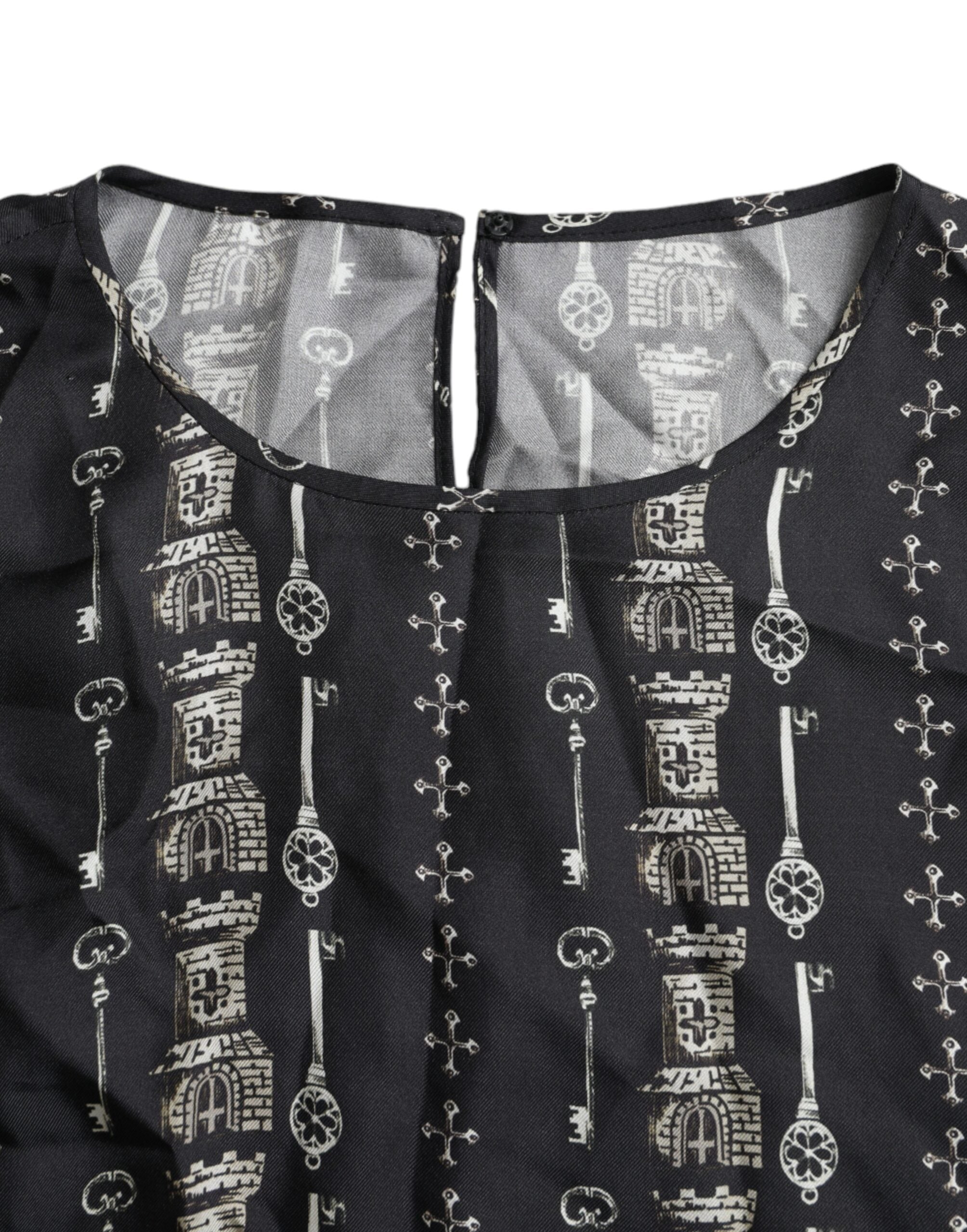 Chemise en soie noire Dolce & Gabbana avec motif clé et château, style blouse élégante, vue de face.