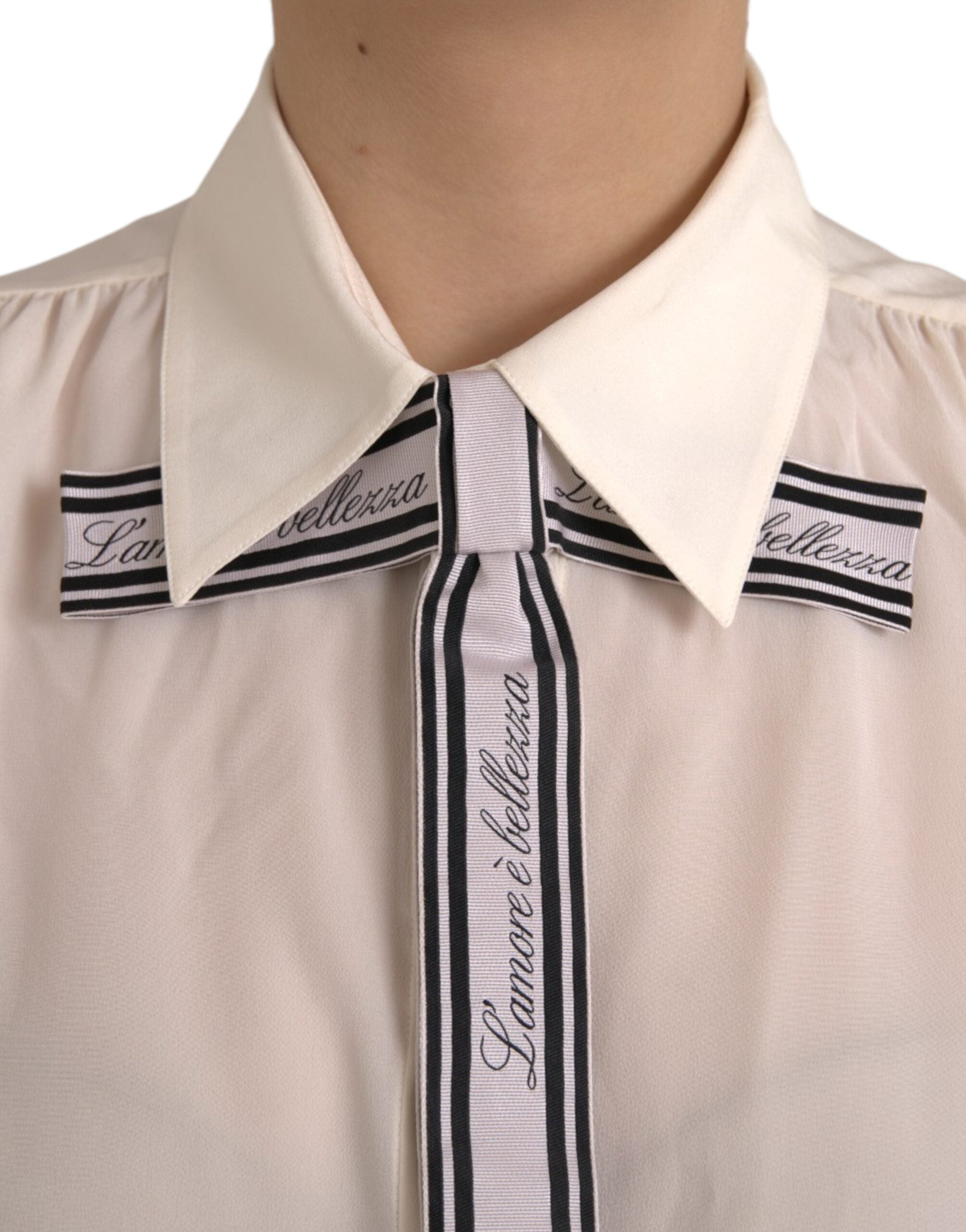 Blouse blanche à manches longues Dolce & Gabbana, chemisier en coton avec boutons, élégante et sophistiquée.