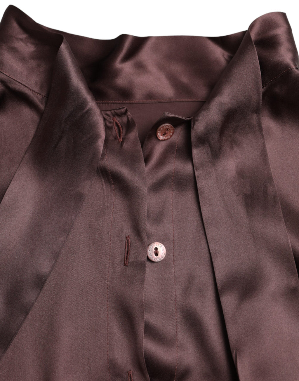 Blouse longue à col ascot marron Dolce & Gabbana avec manches longues, tissu élégant et détails sophistiqués.