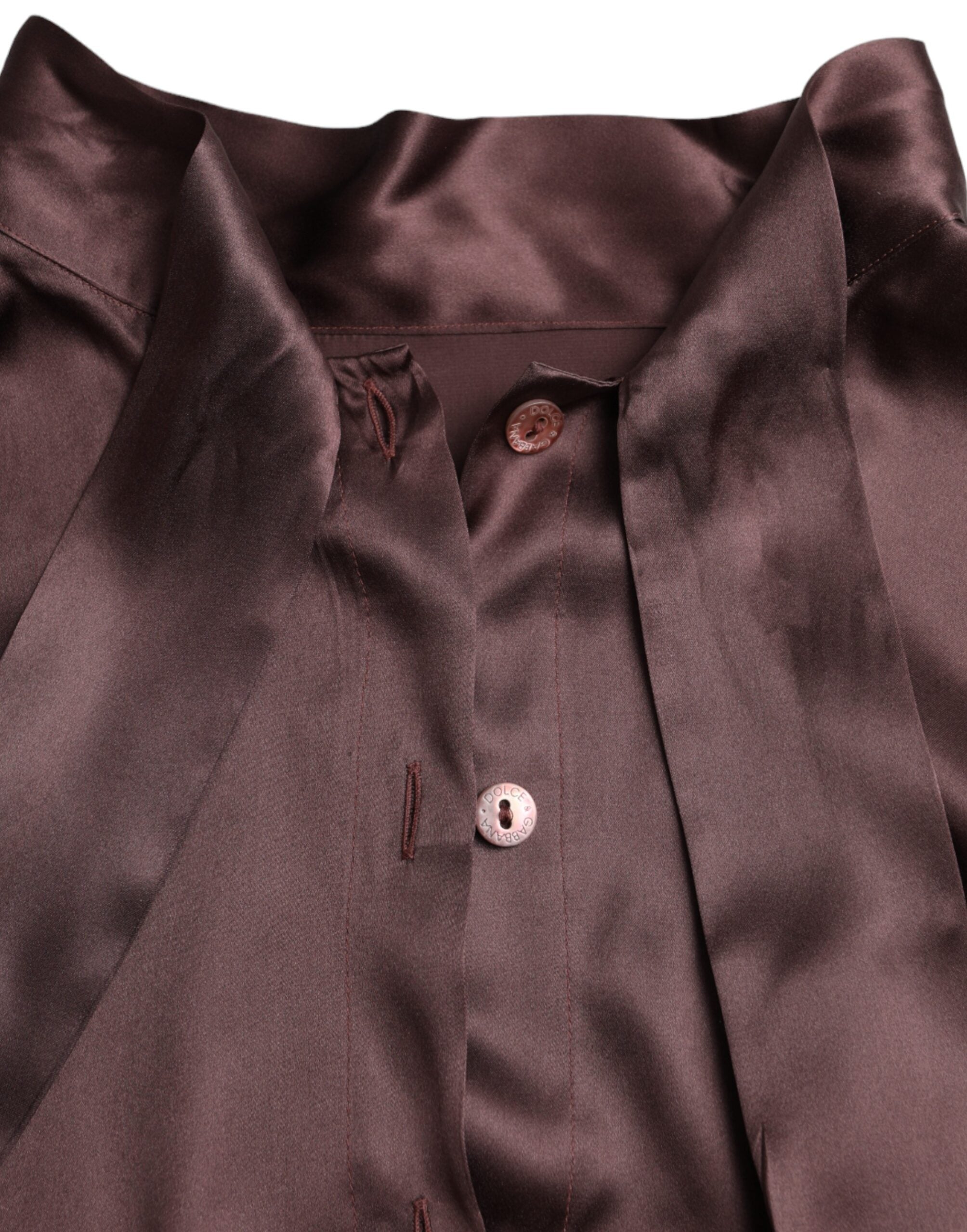 Blouse longue à col ascot marron Dolce & Gabbana avec manches longues, tissu élégant et détails sophistiqués.