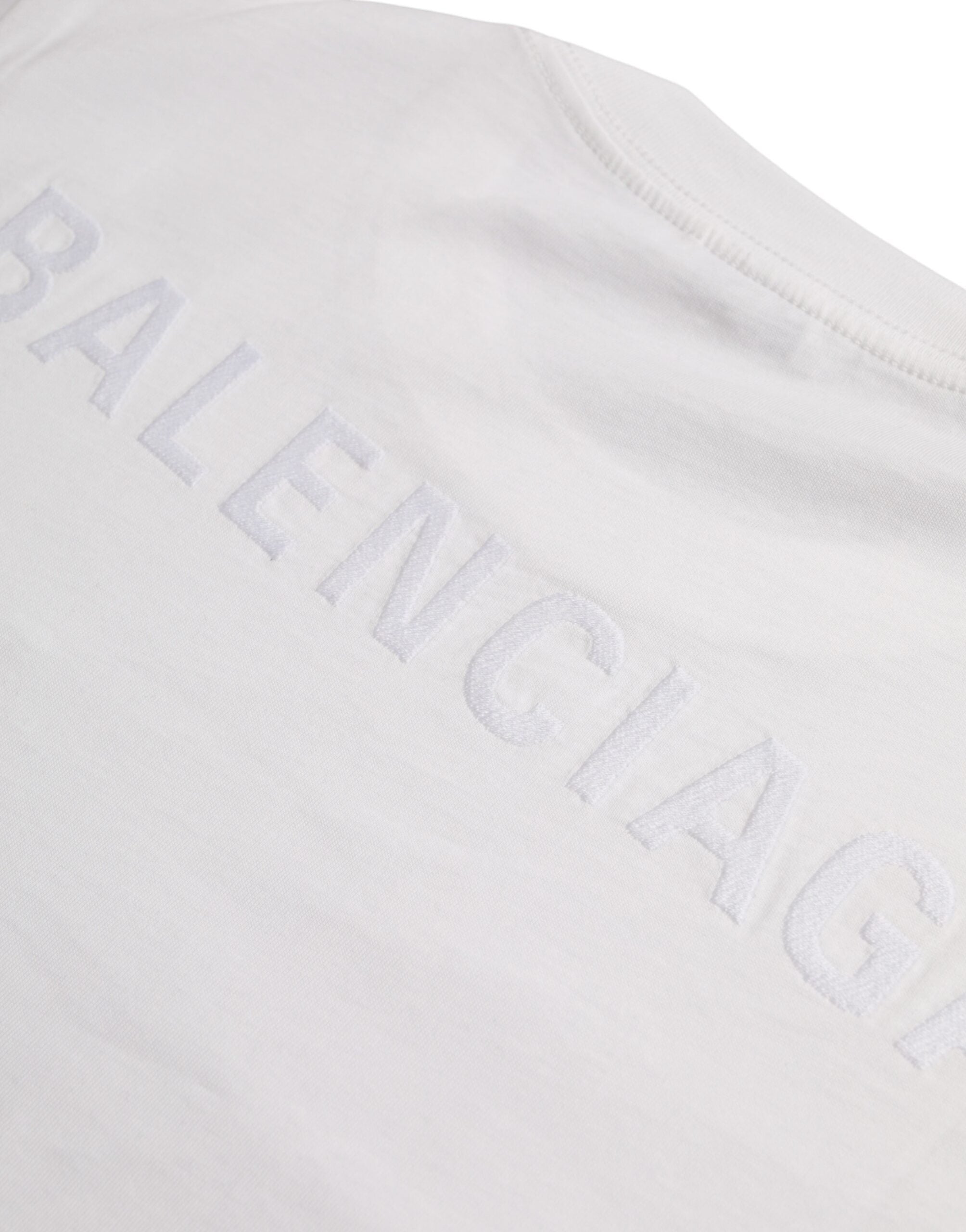 T-shirt blanc à manches courtes en coton de Balenciaga, col rond, style décontracté, visible sur l'image.