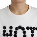 T-shirt blanc en coton Dolce & Gabbana avec détails en cristal noir et design élégant, vue frontale.