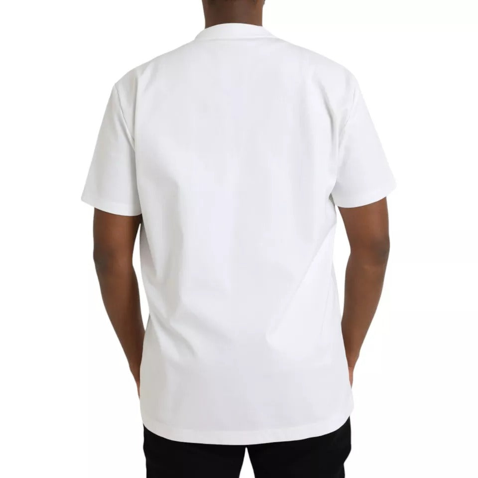 T-shirt blanc en coton Dolce & Gabbana avec logo embossed, col rond et design épuré visible sur l'image.