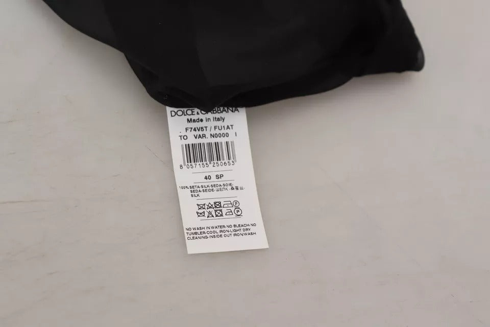 Blouse transparente en mesh noir de Dolce & Gabbana, haut décontracté avec détails fins et style élégant.