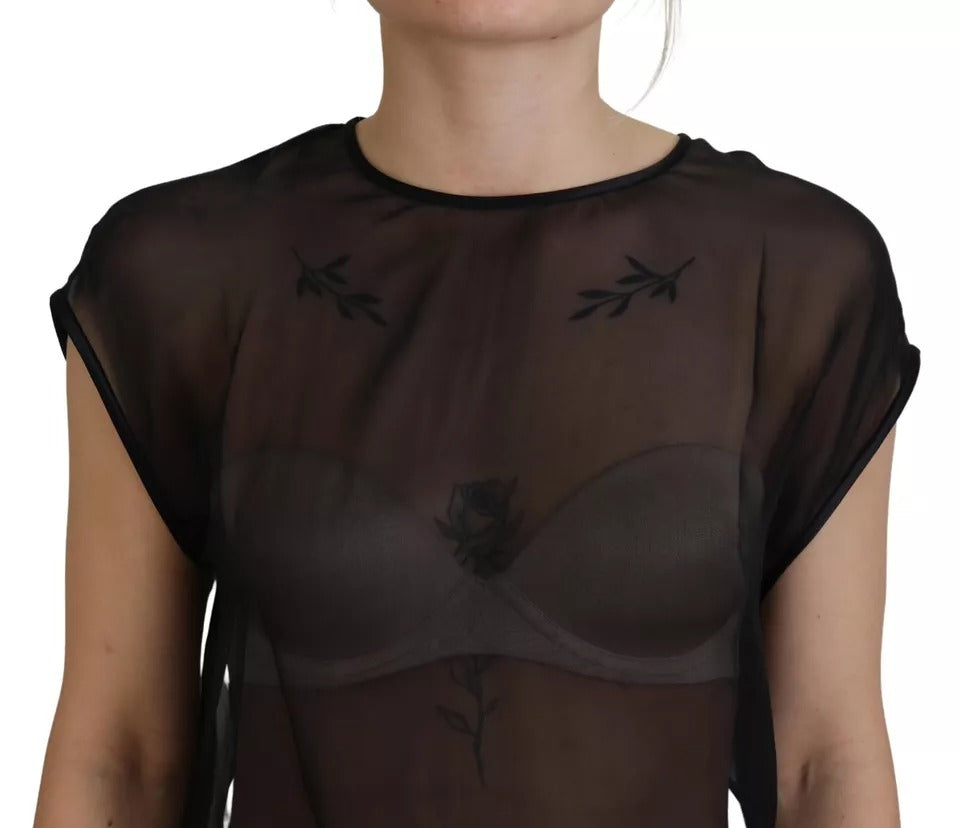 Blouse en résille noire transparente de Dolce & Gabbana, haut léger avec détails en mesh pour un look élégant et moderne.