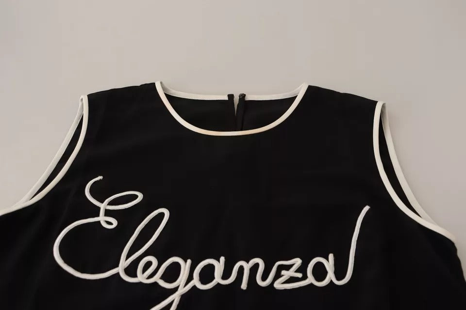 Débardeur sans manches en soie noire Dolce & Gabbana avec imprimé Eleganza, affiche un design élégant et sophistiqué.