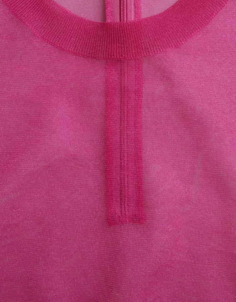 Haut transparent rose à manches longues Dolce & Gabbana, col rond, en tissu léger et élégant.