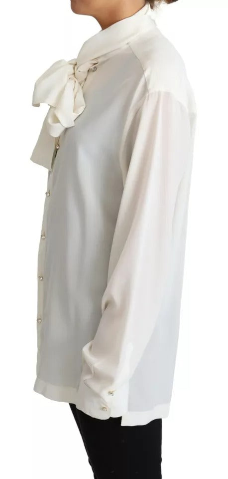 Chemise blanche Dolce & Gabbana en soie avec col ascot, élégante blouse pour femme visible en détail.
