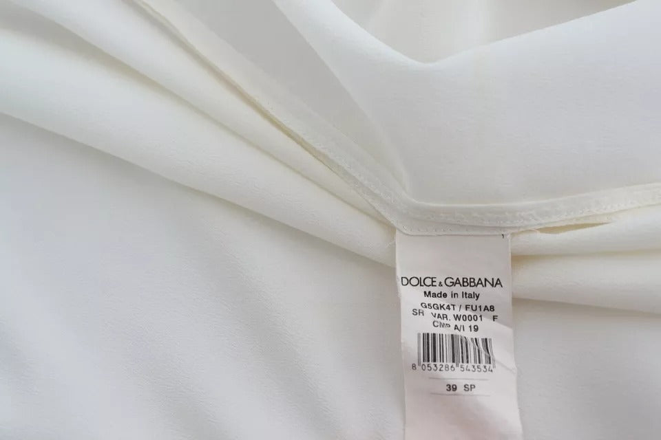 Chemise blanche Dolce & Gabbana avec col ascot en soie, haut élégant et sophistiqué, visible en image.
