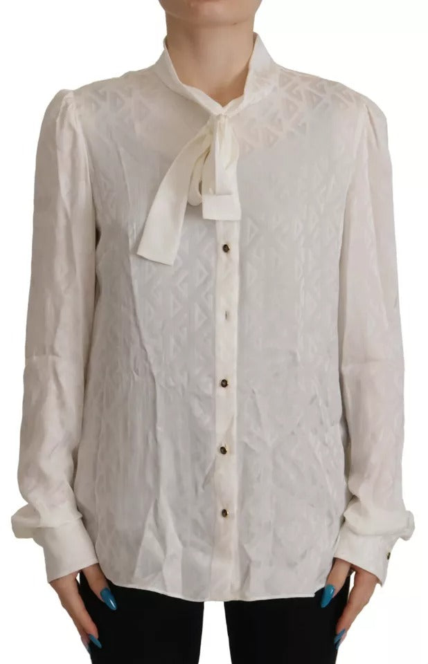 Haut Dolce & Gabbana en soie blanche avec motif, col ascot élégant et design raffiné, vue de face.