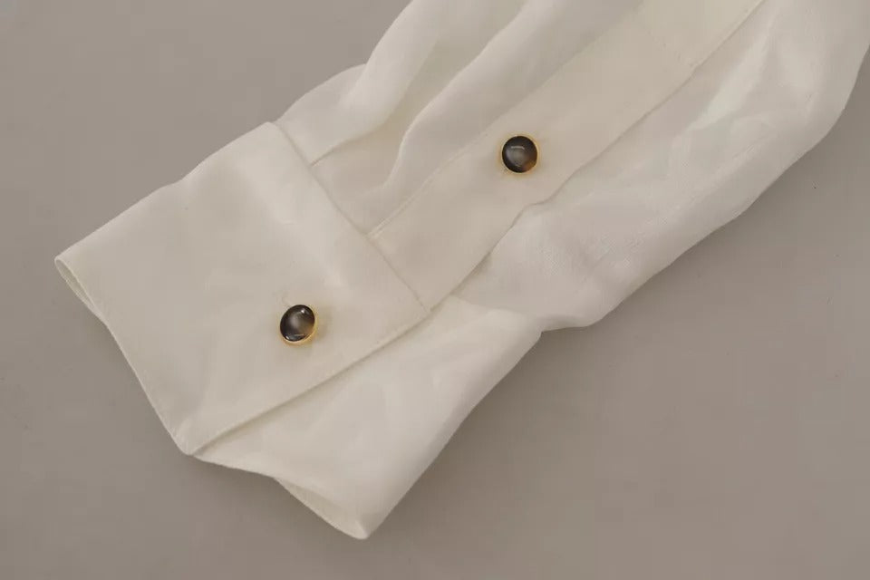 Chemisier Dolce & Gabbana en soie blanche à motif avec col ascot, élégant haut à manches longues et finition raffinée.