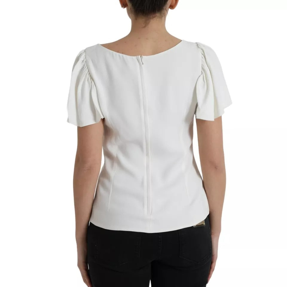 Haut blanc en viscose à col rond et manches courtes de Dolce & Gabbana, tissu léger et élégant.
