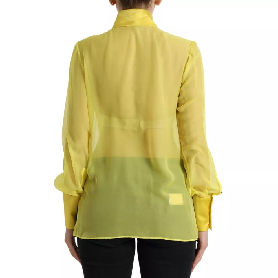 Blouse à manches longues jaune Dolce & Gabbana avec boutons, vue de face, tissu léger et élégant.