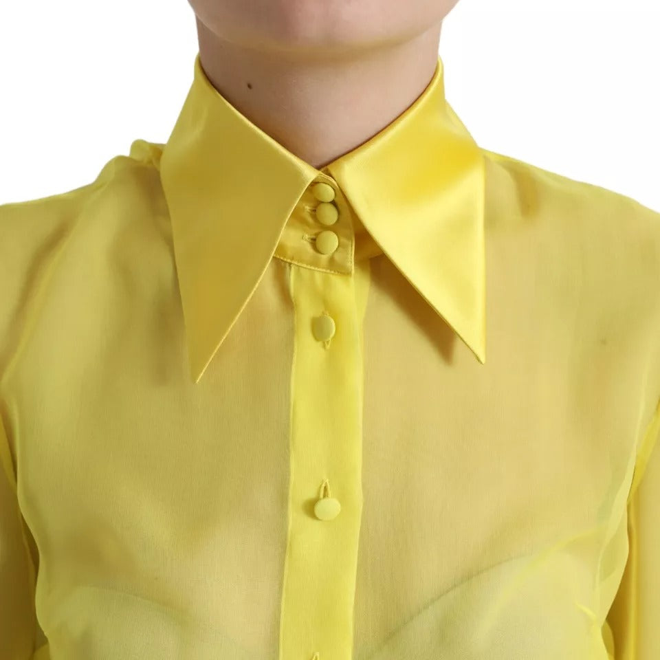 Blouse Dolce & Gabbana jaune à manches longues avec boutons, haut élégant en tissu léger.