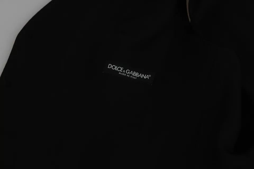 Gilet formel en laine noir Dolce & Gabbana avec taille extensible, porté comme vêtement élégant pour homme.