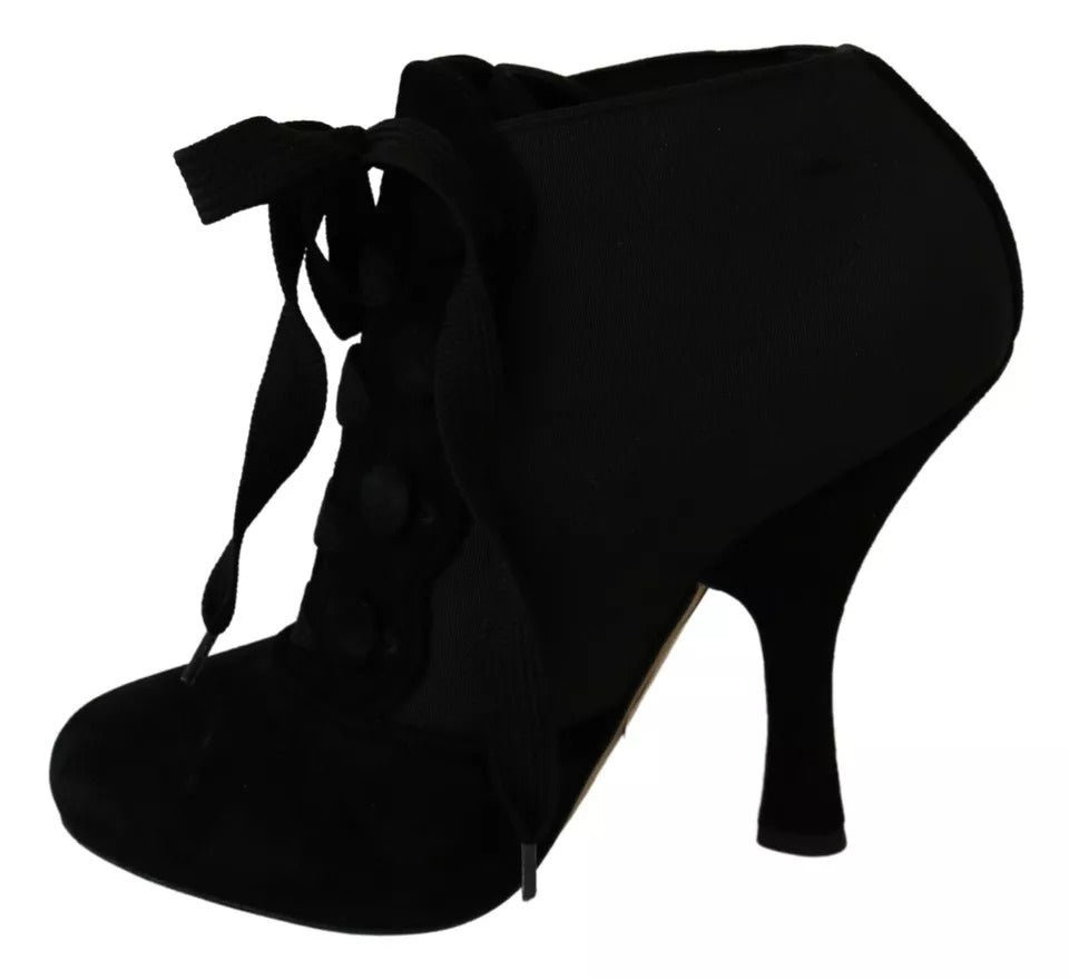Bottines en daim noir Dolce & Gabbana pour homme, semelle fine et design élégant, visibles sur l'image.