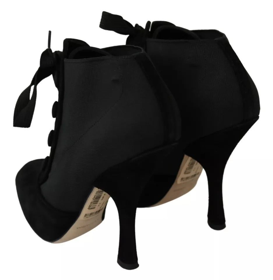 Bottines en daim noir Dolce & Gabbana, ajustées à la cheville, avec semelle élégante et design sophistiqué.