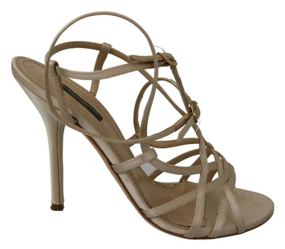 Sandales Dolce & Gabbana en soie dorée avec bride à la cheville et talons, vue de face.