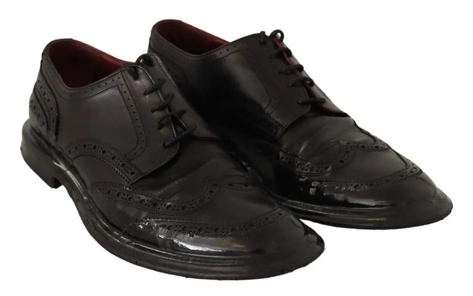 Chaussures Richelieu noires en cuir Dolce & Gabbana pour homme, style brogue avec détails élégants.