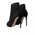 Chaussures Dolce & Gabbana à talons aiguilles en tulle noir, bottines élégantes avec semelle fine et design sophistiqué.