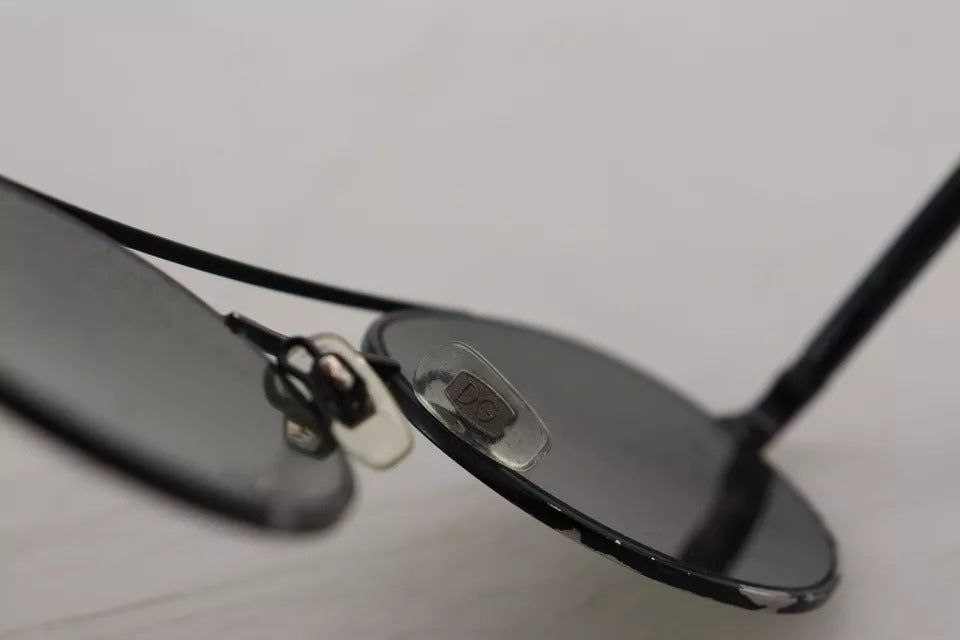 Lunettes de soleil Dolce & Gabbana avec monture en acier noir mat et verres verts, modèle DG2245.