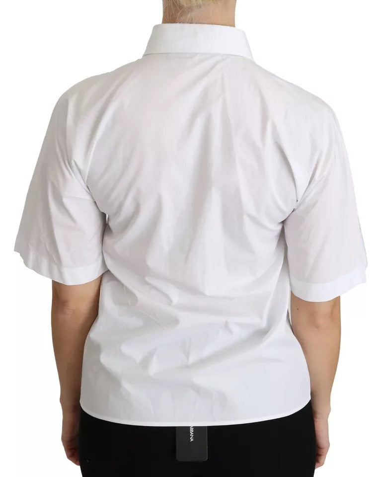 Chemise polo blanche Dolce & Gabbana à col et manches courtes, élégante et classique, idéale pour un style chic et décontracté.