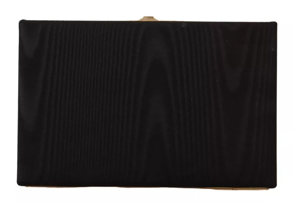 Sac pochette Dolce & Gabbana en soie noire avec cadre doré, parfait pour soirée et événements élégants.