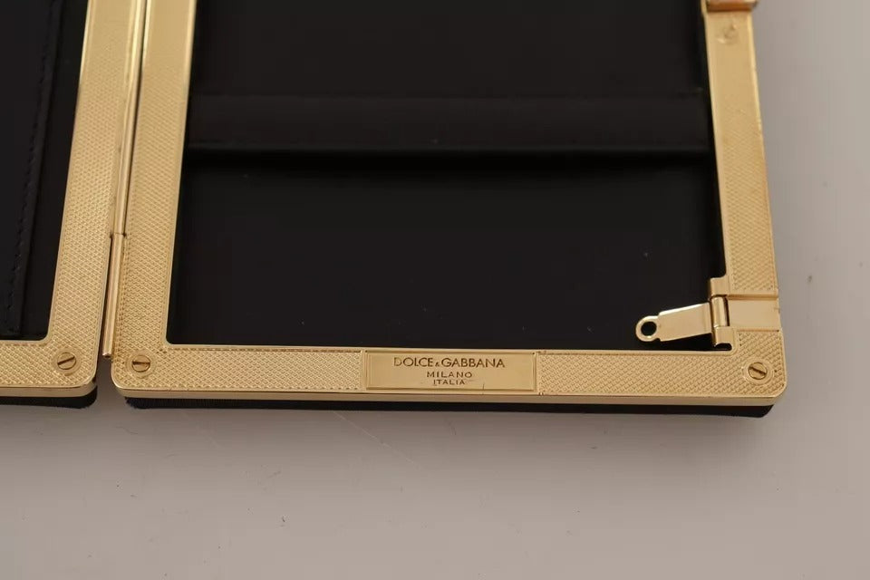 Pochette de soirée Dolce & Gabbana en soie noire avec cadre doré, idéale pour les événements élégants.