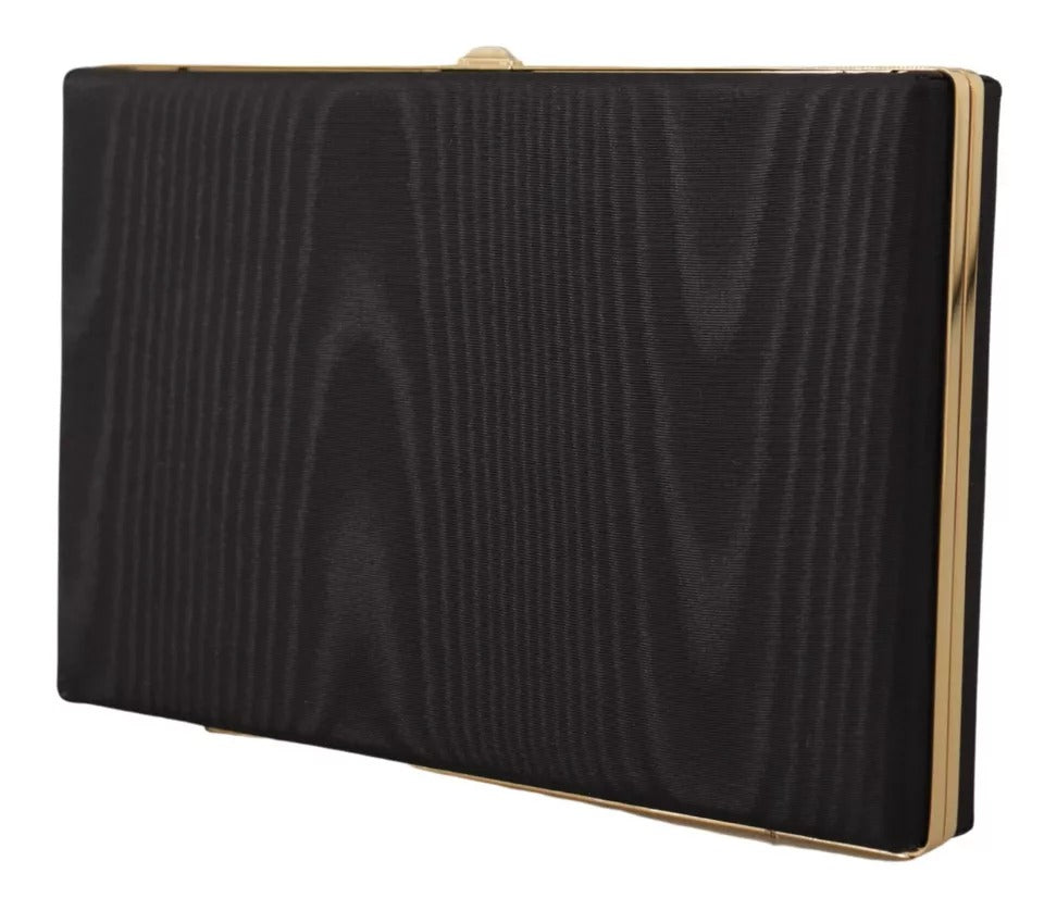 Pochette de soirée en soie noire Dolce & Gabbana avec cadre doré, idéale pour soirées élégantes et événements spéciaux.
