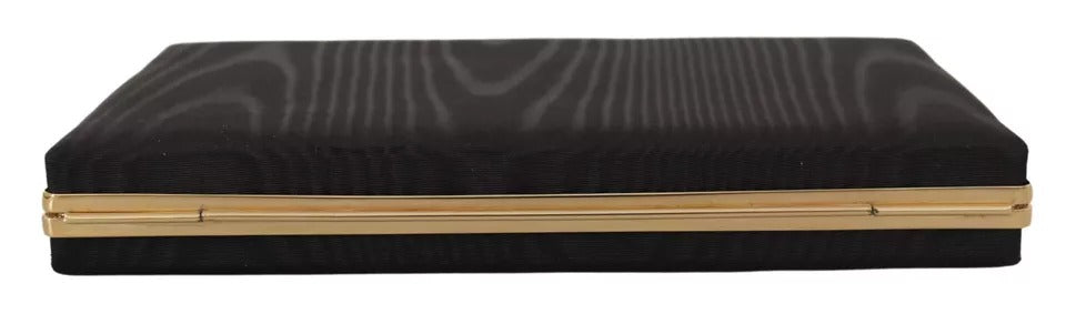 Sac pochette en soie noire Dolce & Gabbana avec cadre doré, idéal pour soirée et événements élégants.