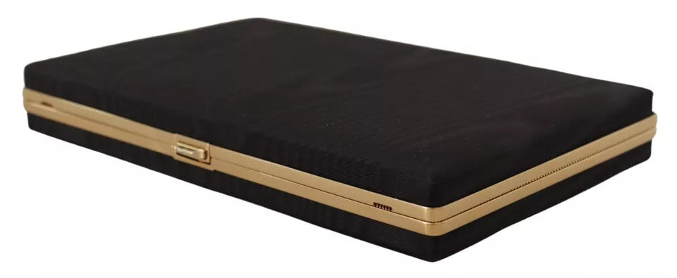Sac clutch en soie noire Dolce & Gabbana avec cadre doré, élégant pour soirée ou fête.