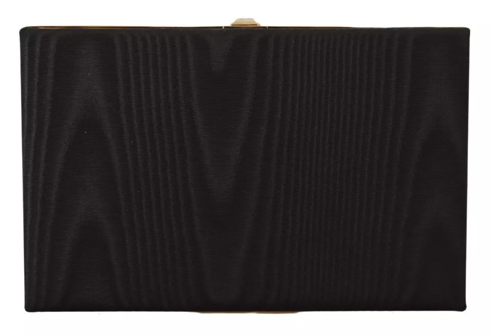 Pochette Dolce & Gabbana en soie noire avec cadre doré, clutch élégante pour soirée ou fête.