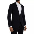 Manteau blazer en laine bleue Dolce & Gabbana avec col à revers et boutonnage simple, porté sur un mannequin.