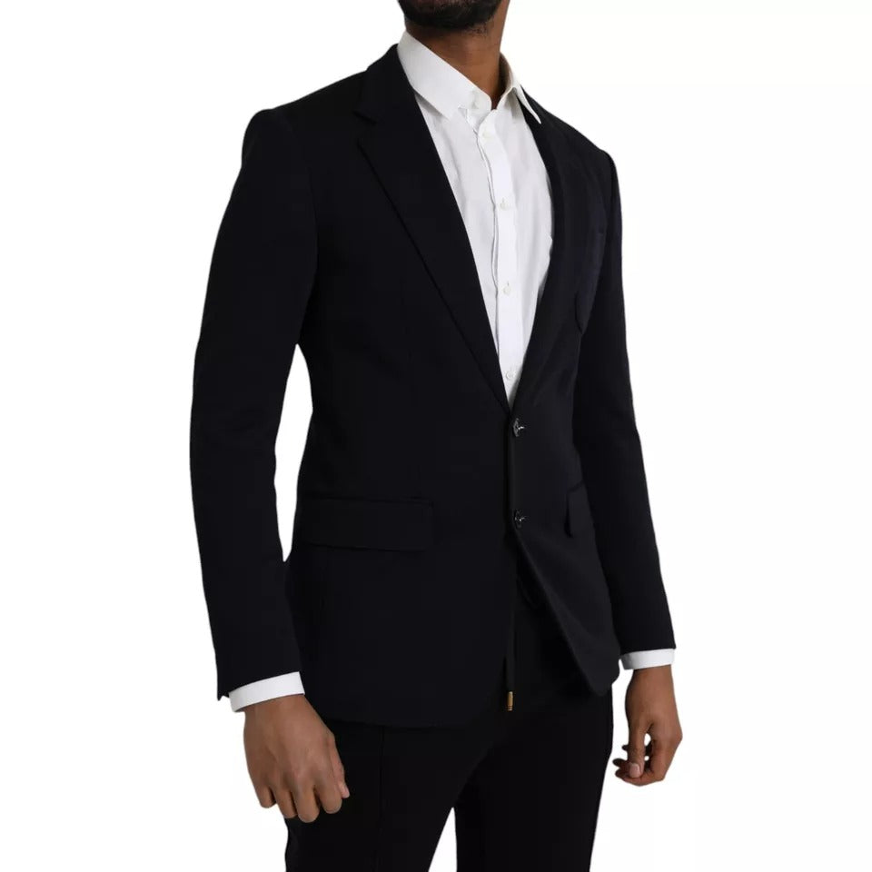 Manteau blazer en laine bleue Dolce & Gabbana avec col à revers et boutonnage simple, porté sur un mannequin.