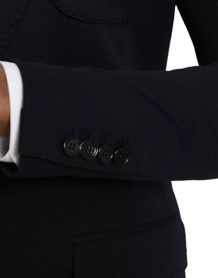 Manteau blazer Dolce & Gabbana en laine bleue à col cranté et boutonnière simple, côté gauche visible.