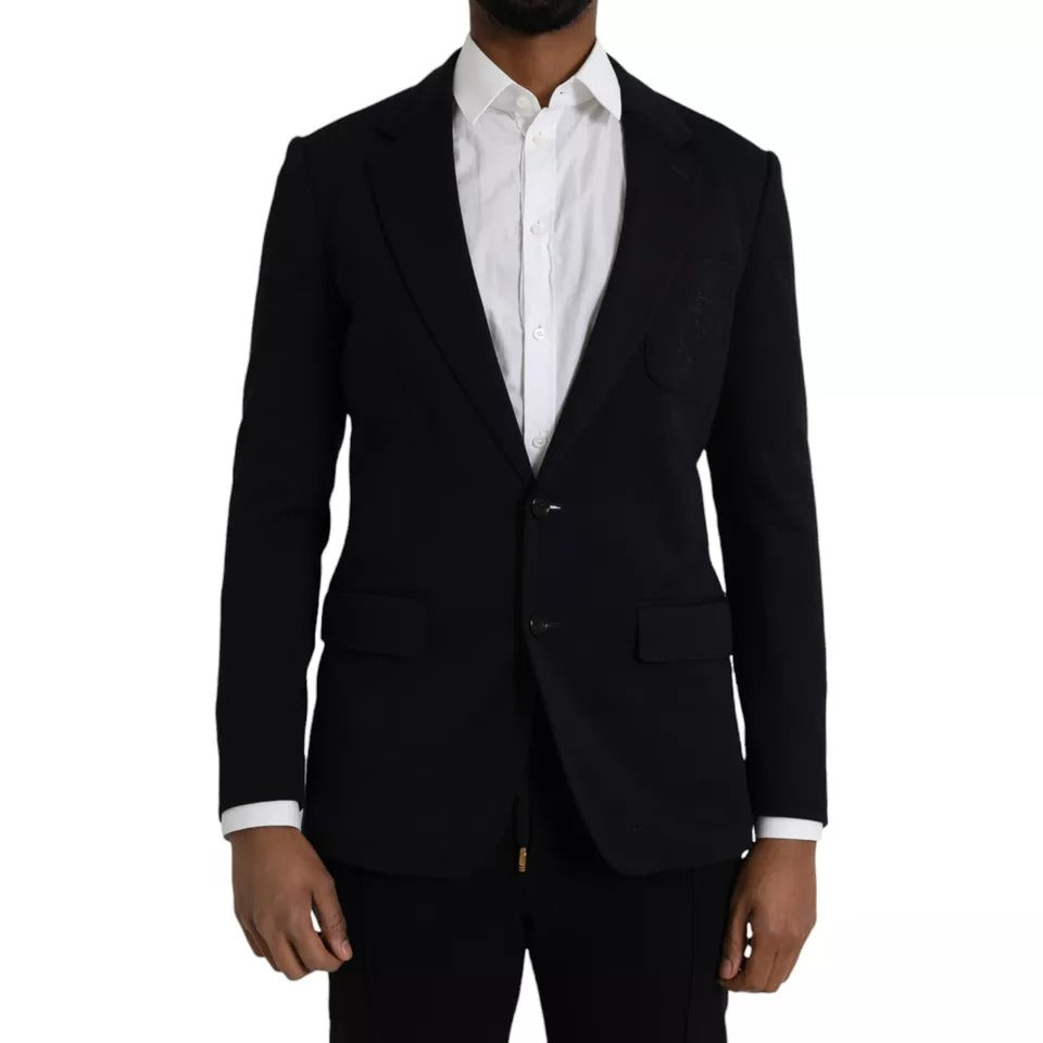 Manteau blazer en laine bleue Dolce & Gabbana avec col à pente simple et fermeture à boutons, porté sur un mannequin.