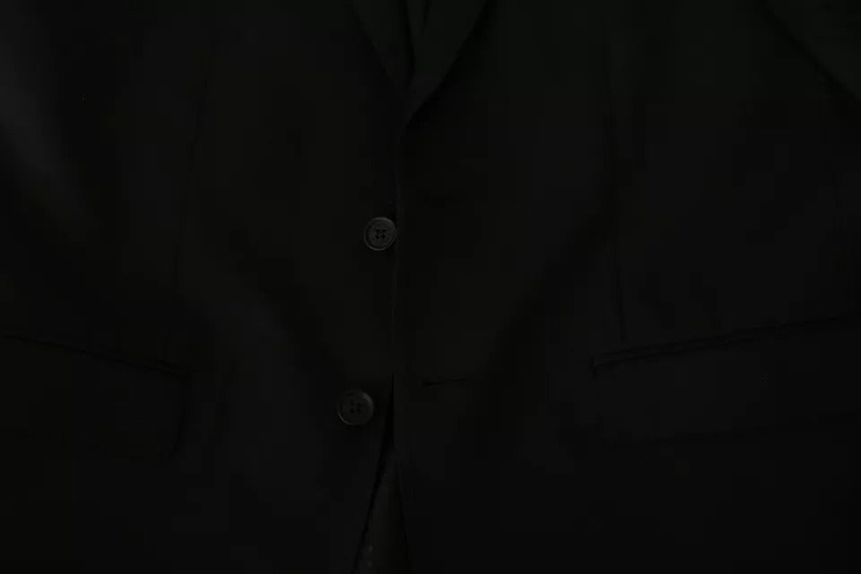 Veste blazer noire en laine Dolce & Gabbana, coupe ajustée, col à revers, style élégant et sophistiqué.