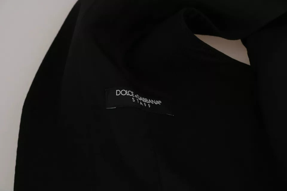 Gilet noir Dolce & Gabbana en tissu uni, coupe slim, sans manches, avec col en V et fermeture à boutons.