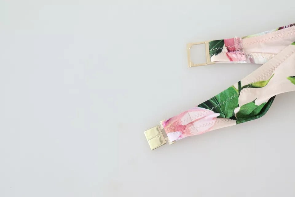 Maillot de bain bikini Dolce & Gabbana à fleurs roses, haut de plage élégant et coloré, parfait pour l'été.