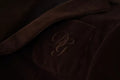 Blazer Dolce & Gabbana en velours côtelé marron, coupe slim, avec logo DG visible sur le devant.