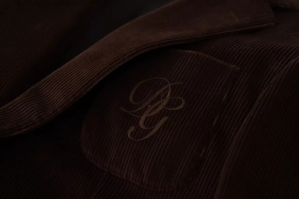 Blazer Dolce & Gabbana en velours côtelé marron, coupe slim, avec logo DG visible sur le devant.