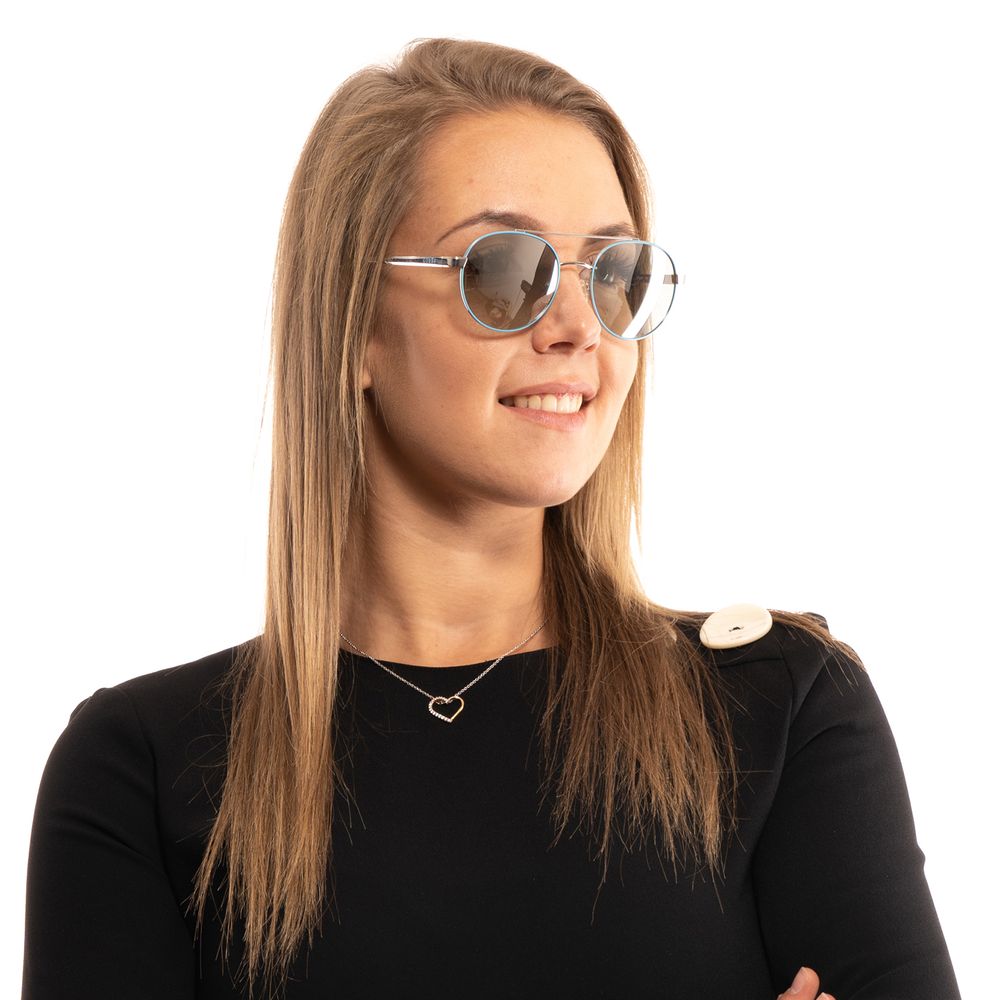 Lunettes de soleil métalliques turquoise Guess pour femmes avec monture élégante et design tendance, vue de face.