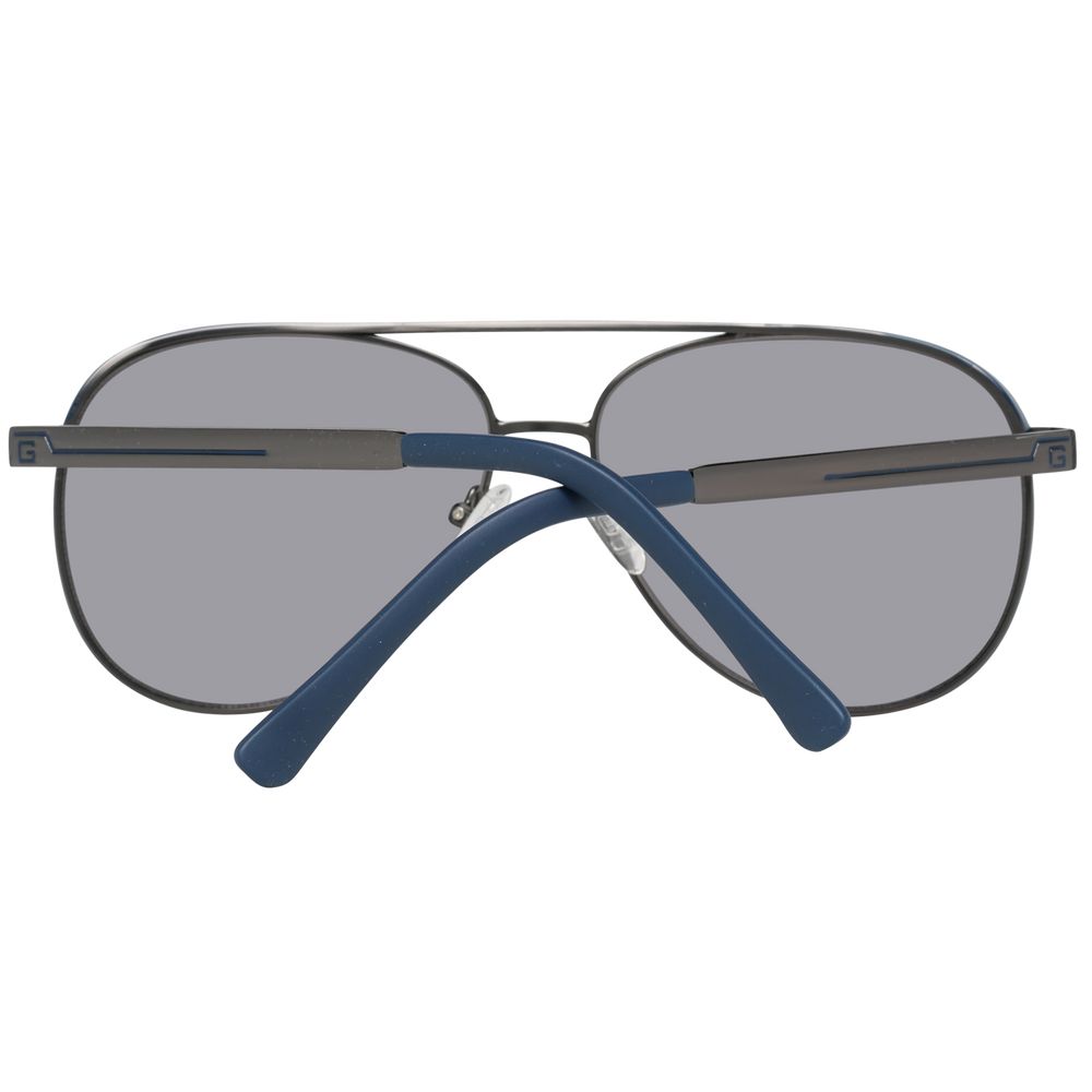 Lunettes de soleil en métal gris Guess, style moderne avec monture fine et branches élégantes, pour un look tendance.