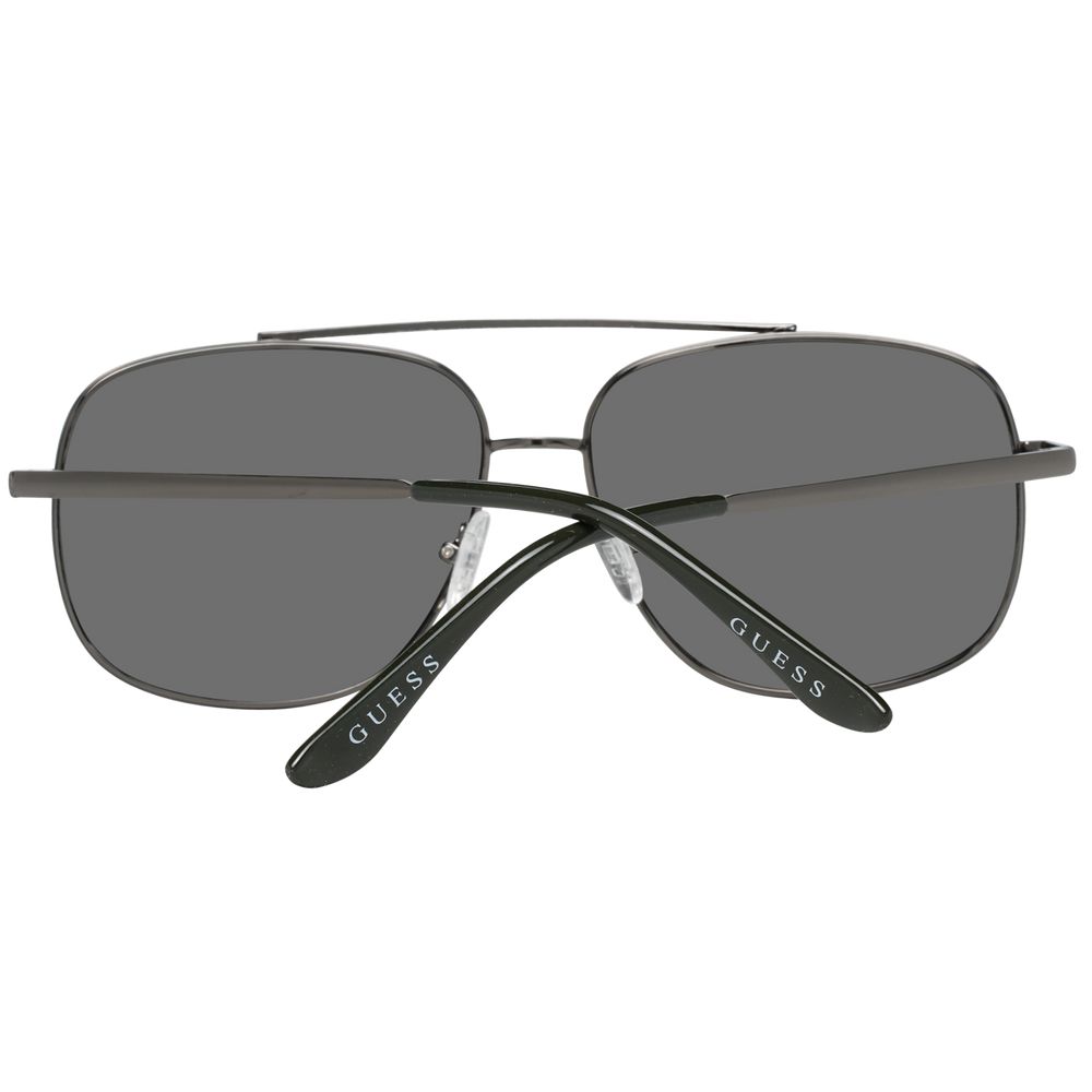 Lunettes de soleil en métal gris Guess, style élégant avec monture fine et branches fines, pour un look moderne et sophistiqué.