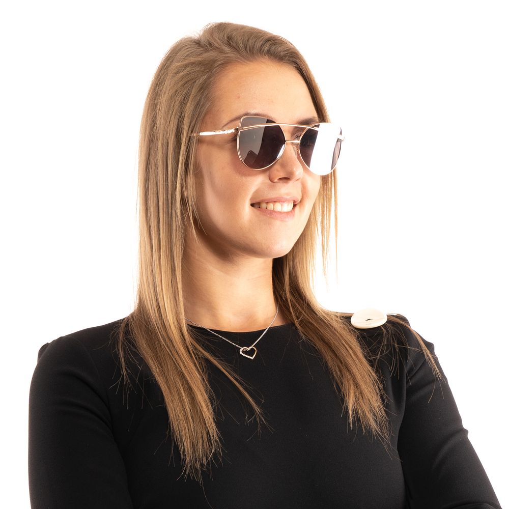 Lunettes de soleil en métal or rose Guess avec monture élégante et branches fines, mode et sophistiquées.