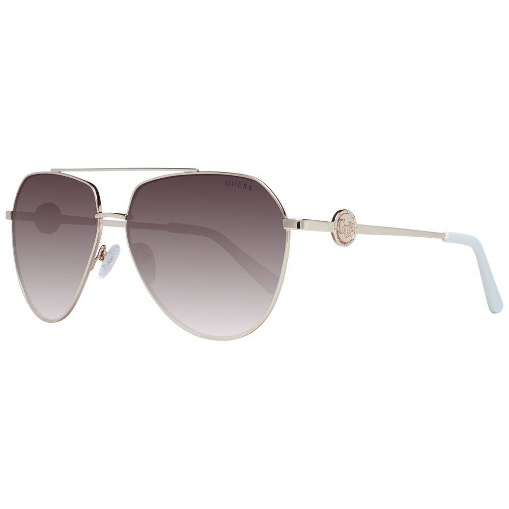 Lunettes de soleil en métal doré Guess pour hommes ou femmes, style élégant avec monture fine et verres teintés.