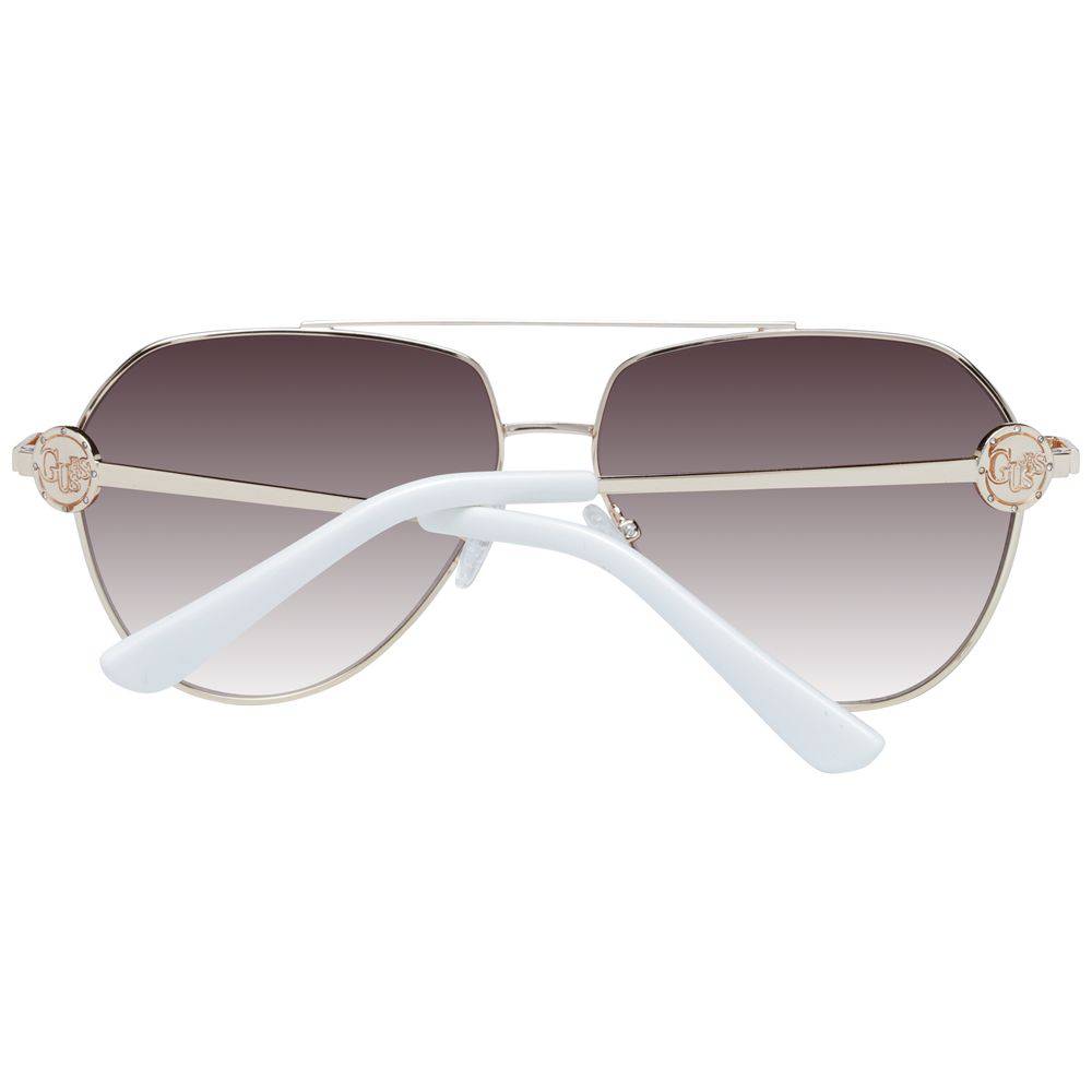 Lunettes de soleil en métal doré Guess, style élégant avec monture fine et verres teintés, pour un look sophistiqué.