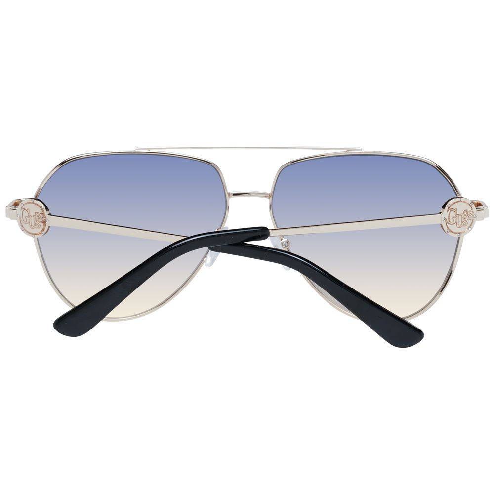 Lunettes de soleil en métal doré Guess, style moderne avec monture fine et verres teintés pour un look élégant et tendance.