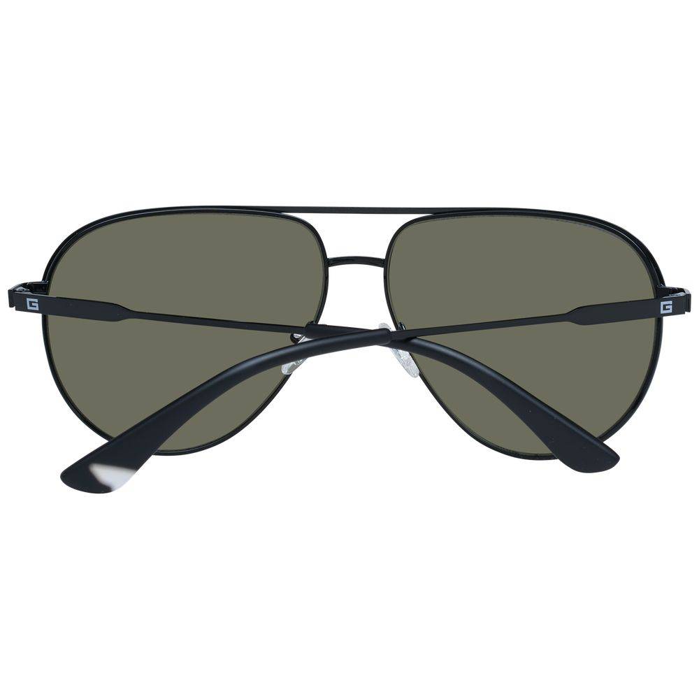 Lunettes de soleil en métal noir Guess, style moderne avec monture fine et verres teintés pour un look élégant.
