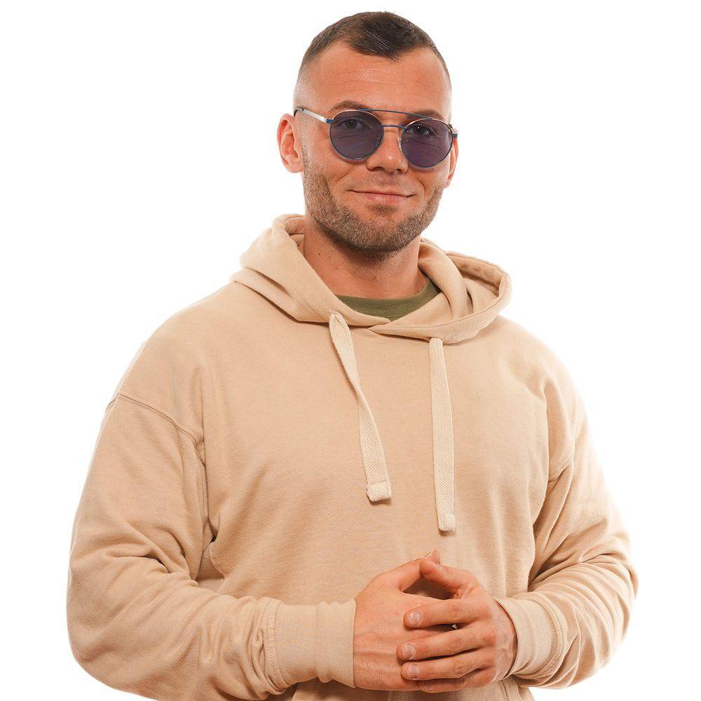Lunettes de soleil Guess en métal et plastique bleues avec monture élégante et branches larges, pour un look tendance.